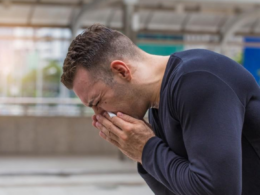 man sneezing because of his allergy