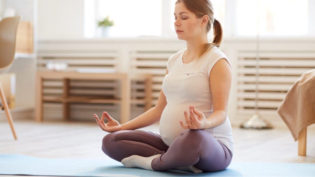 pregnant woman doing yoga
